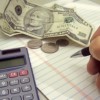 Hand making budget with the calculator