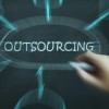 "outsourcing" word with hand pointing to it
