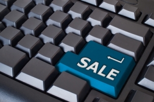 Blue "Sale" button on black keyboard