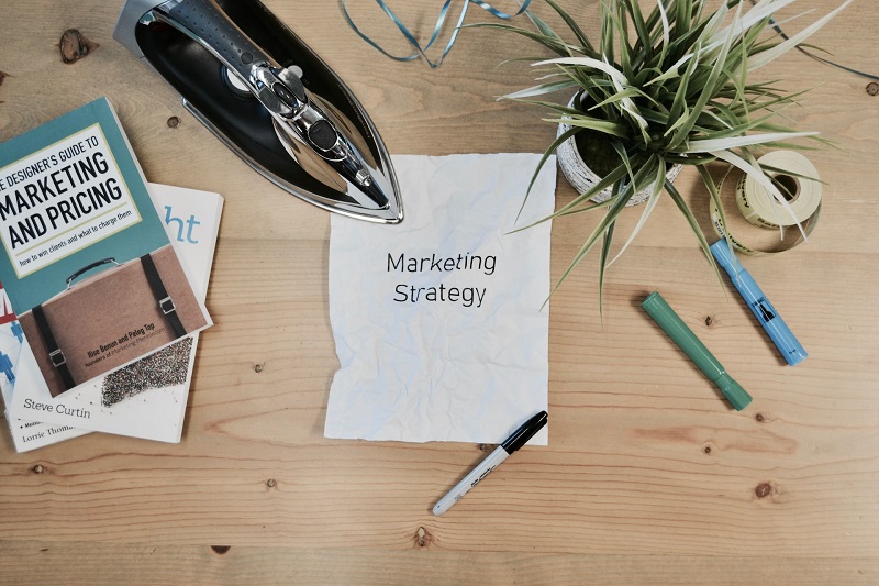 A picture of a paper with the words ‘marketing strategy’ on them, something that Darren and MIke help clients to build.